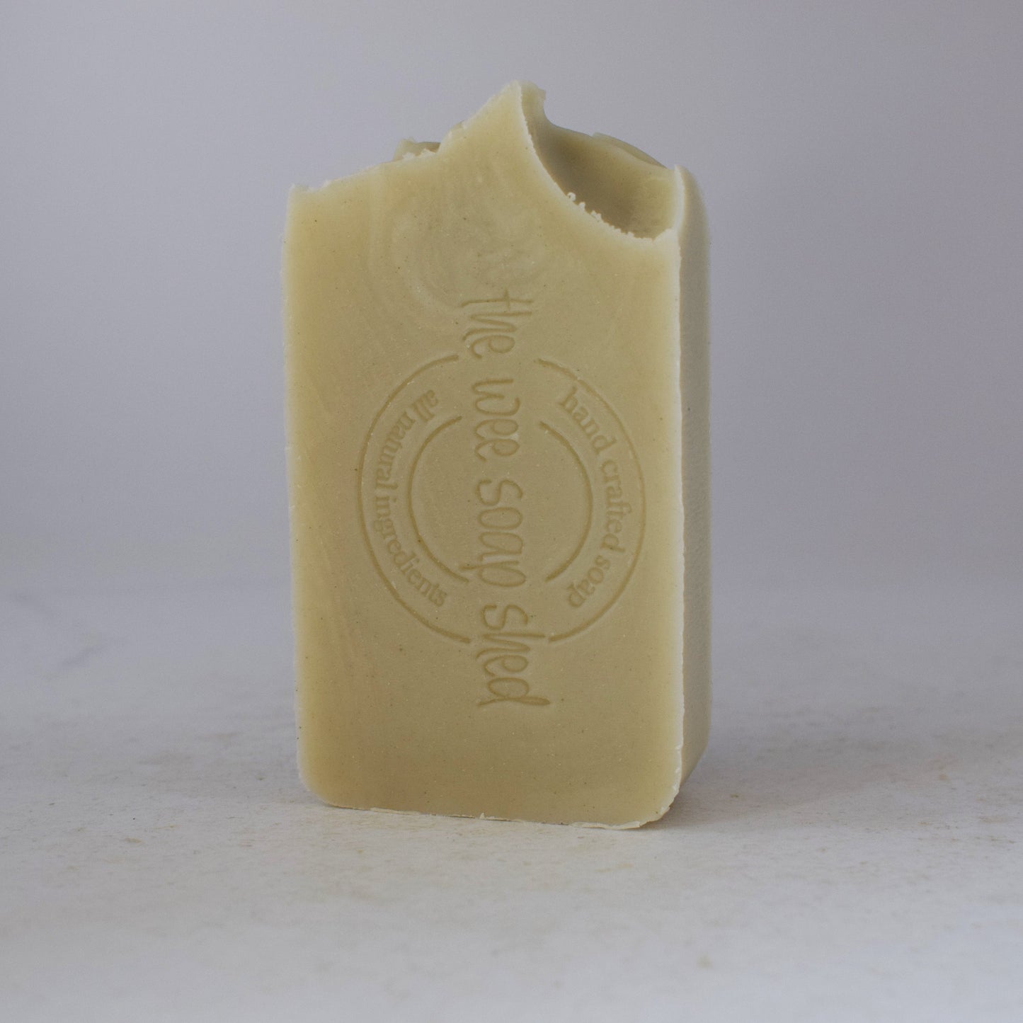 Bar of soap with a brand logo on a white background