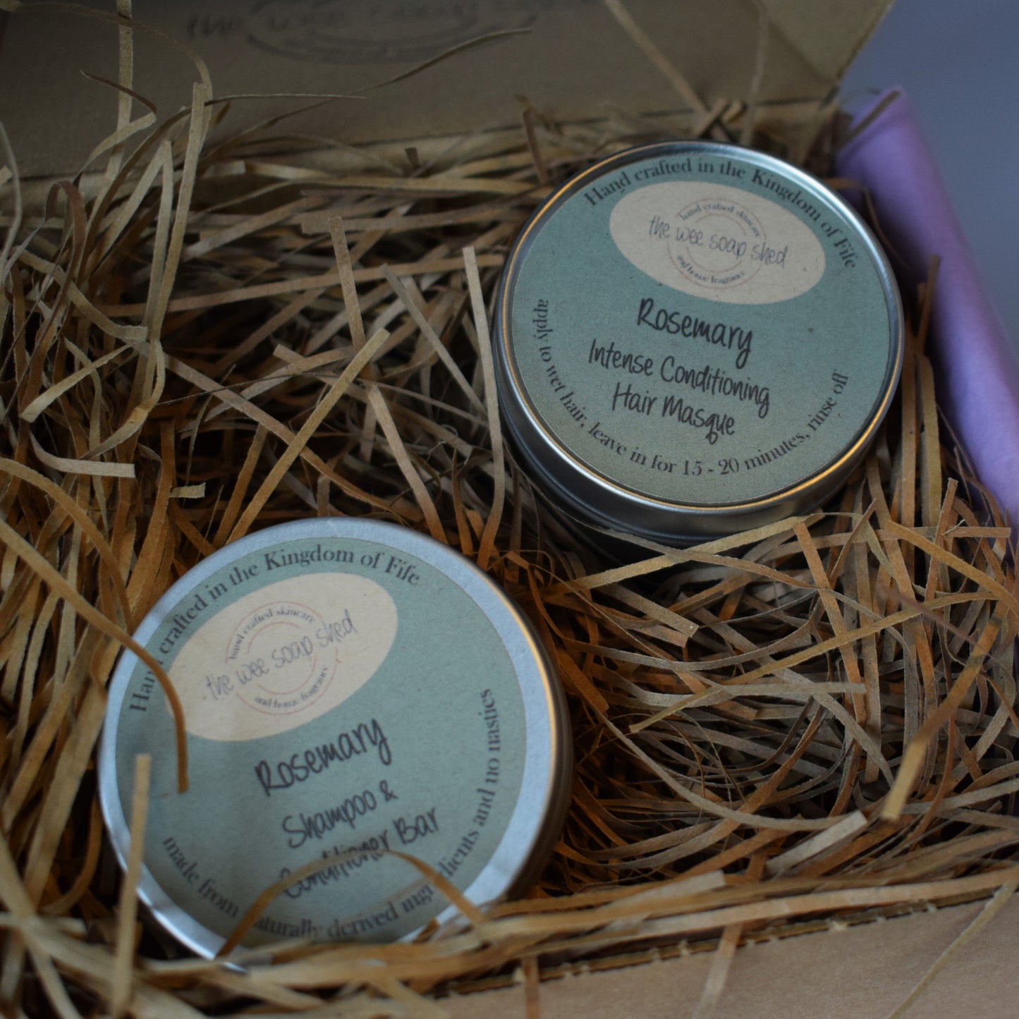 Two tins of Rosemary & Spearmint Conditioner Bar in a box with straw bedding.